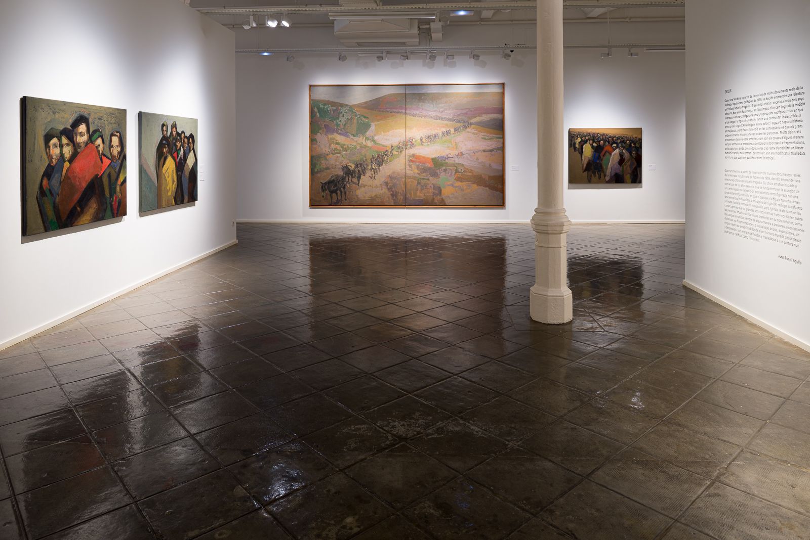 Art gallery featuring Guerrero Medina's paintings, with group portraits on the left and a large landscape painting in the center.